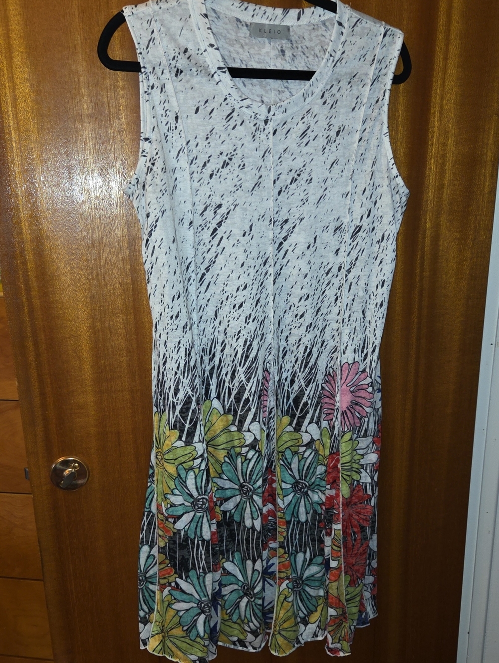 Sleeveless White Maxi Dress with Multicolor Floral Hem